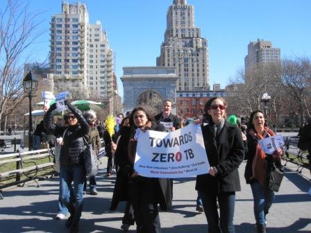 This photo shows a group of people walking through Washington Square Park in New York City for World TB Day.